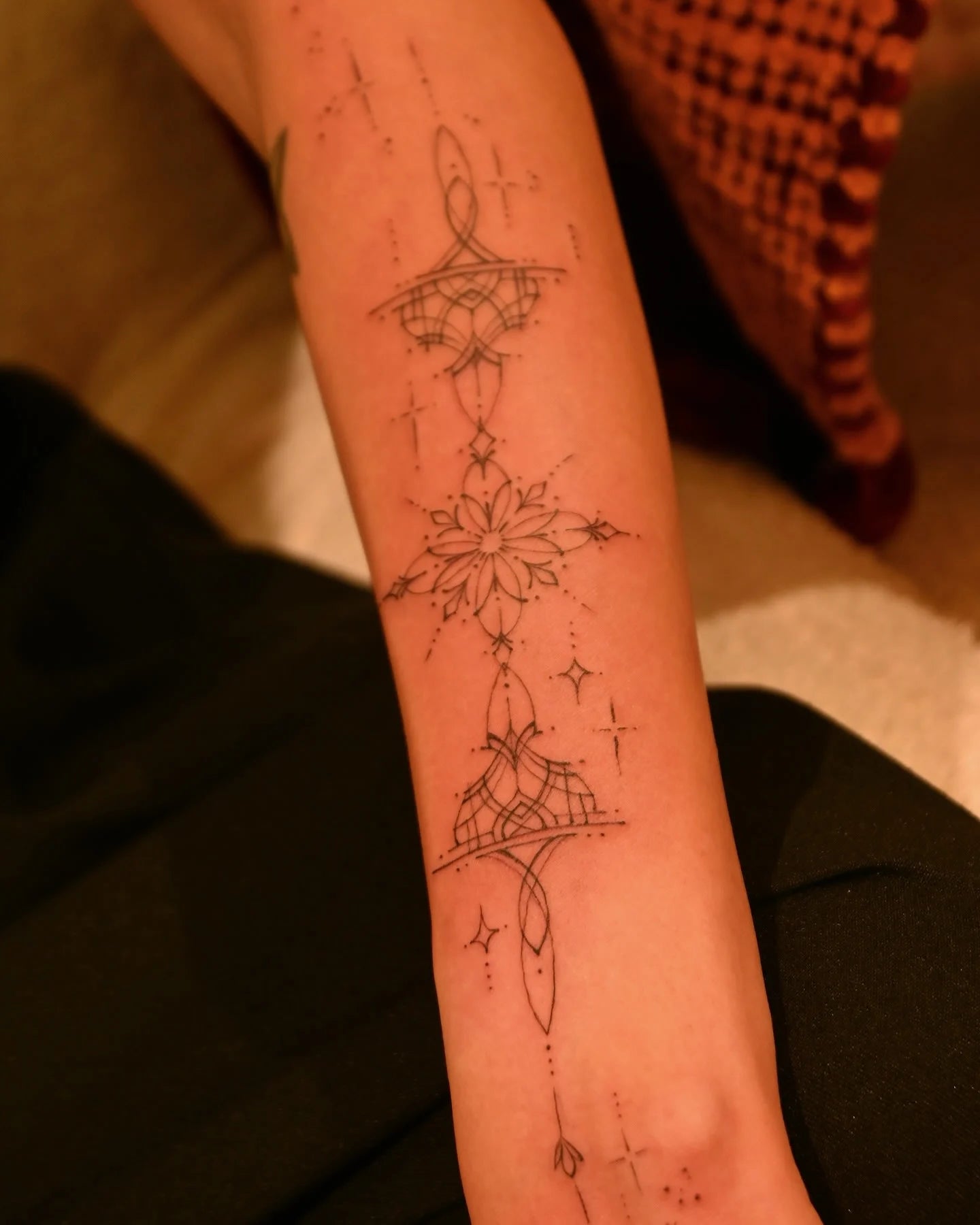 feminine ornamental fine line forearm tattoo 