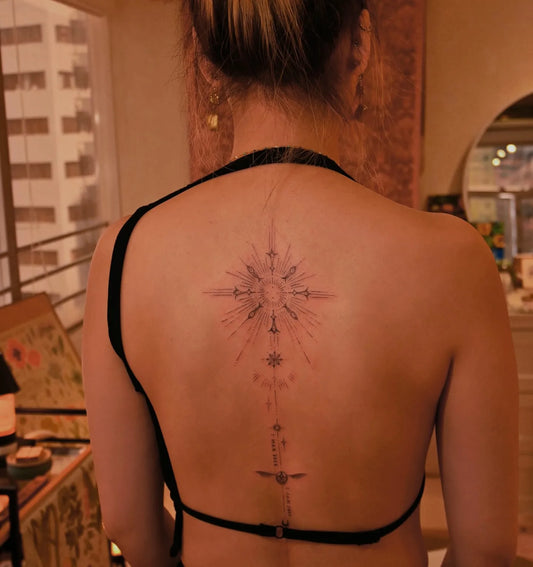 feminine ornamental back tattoo 