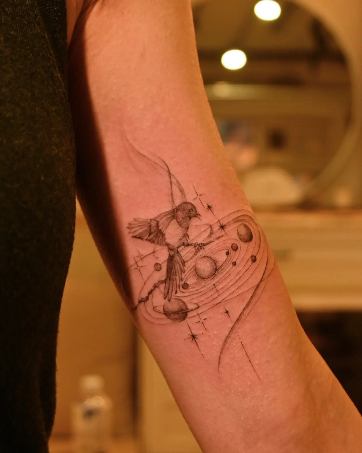 feminine celestial bicep tattoo 