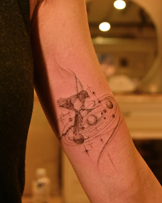 feminine celestial bicep tattoo 