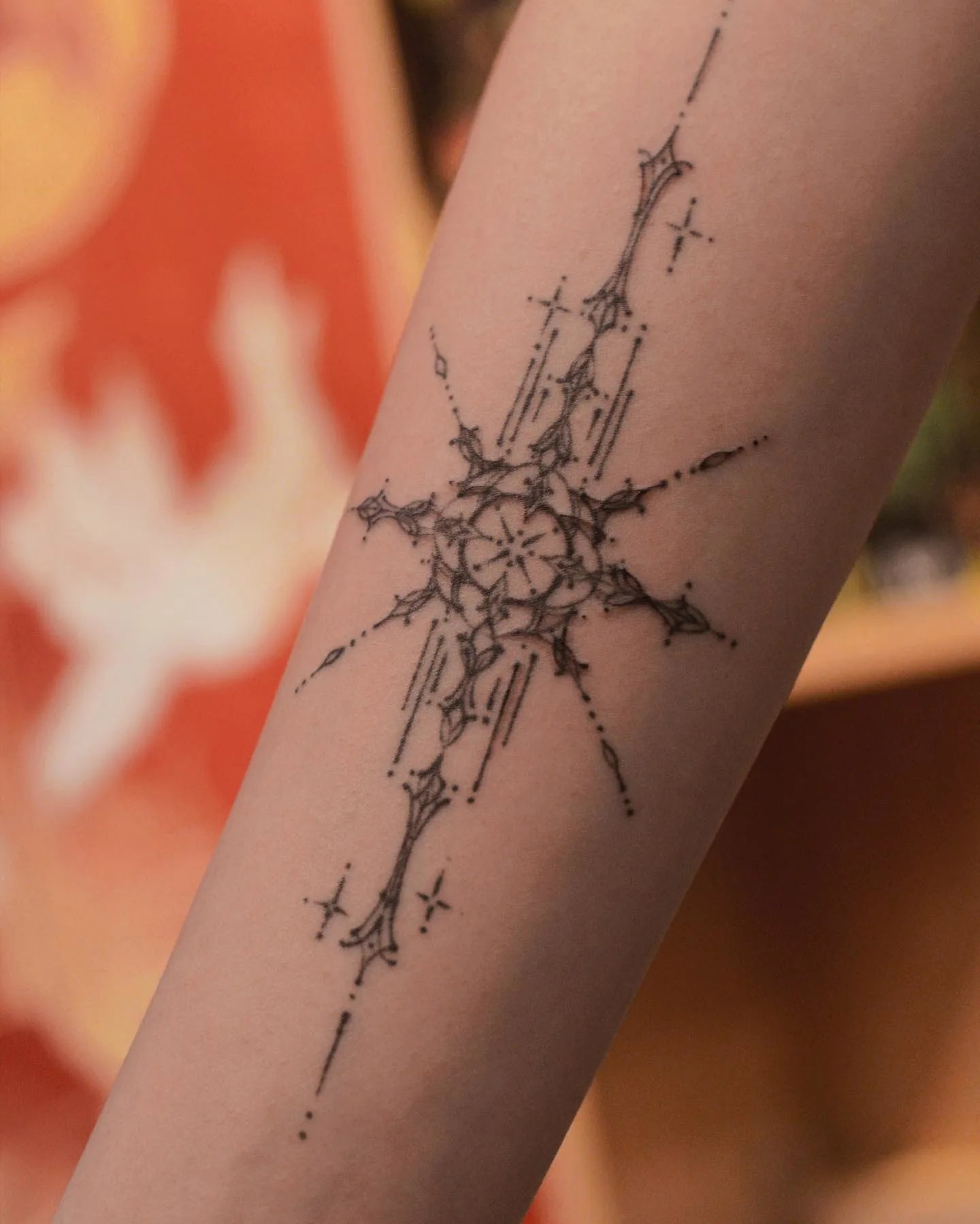 feminine ornamental fine line forearm tattoo 