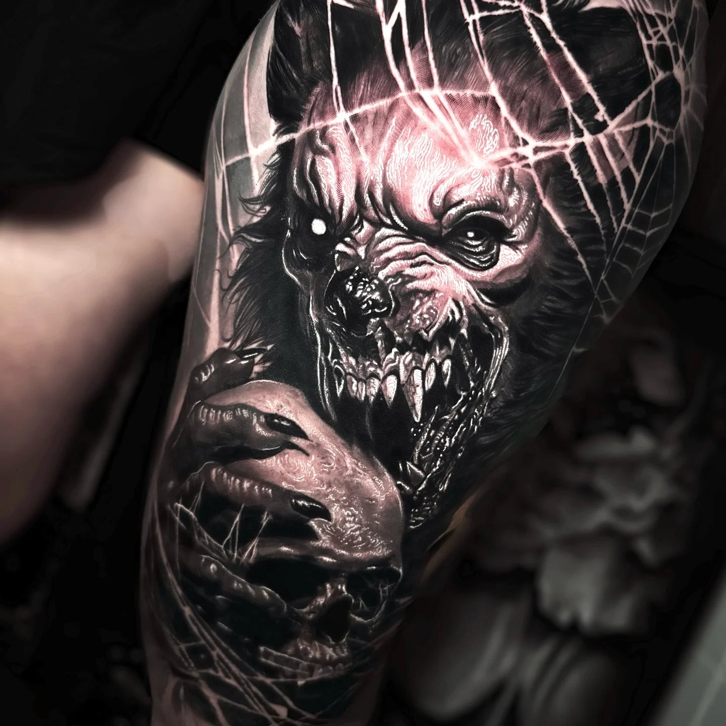 black and grey werewolf eating skull realism tattoo