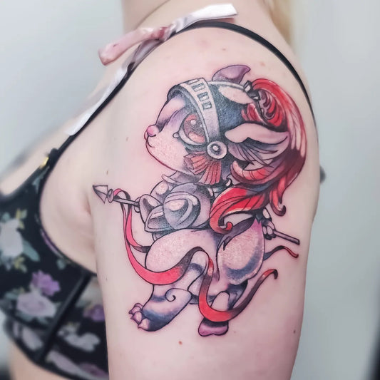 color anime cartoon upper arm tattoo