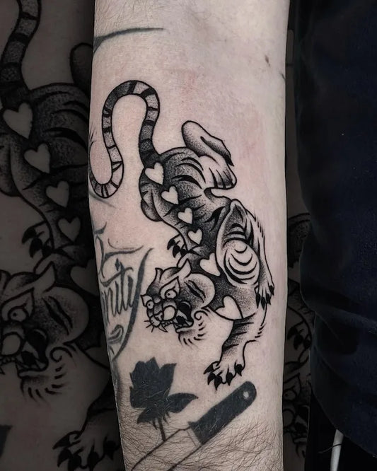 traditional black and grey dotwork tiger with hearts tattoo