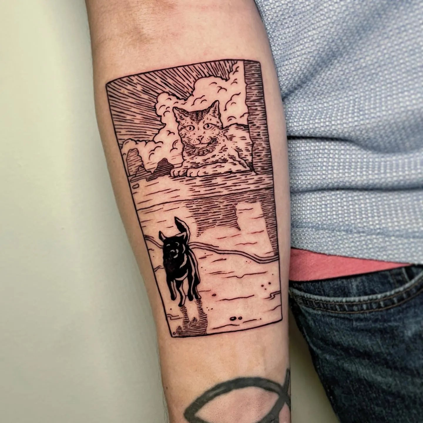 dog and cat portrait forearm tattoo