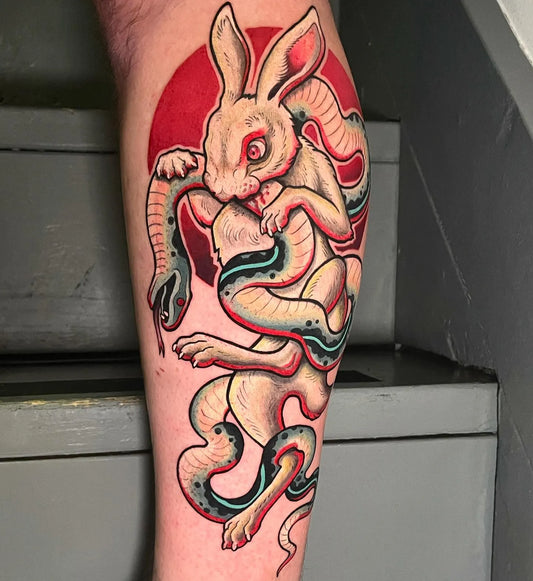 rabbit eating snake new school tattoo