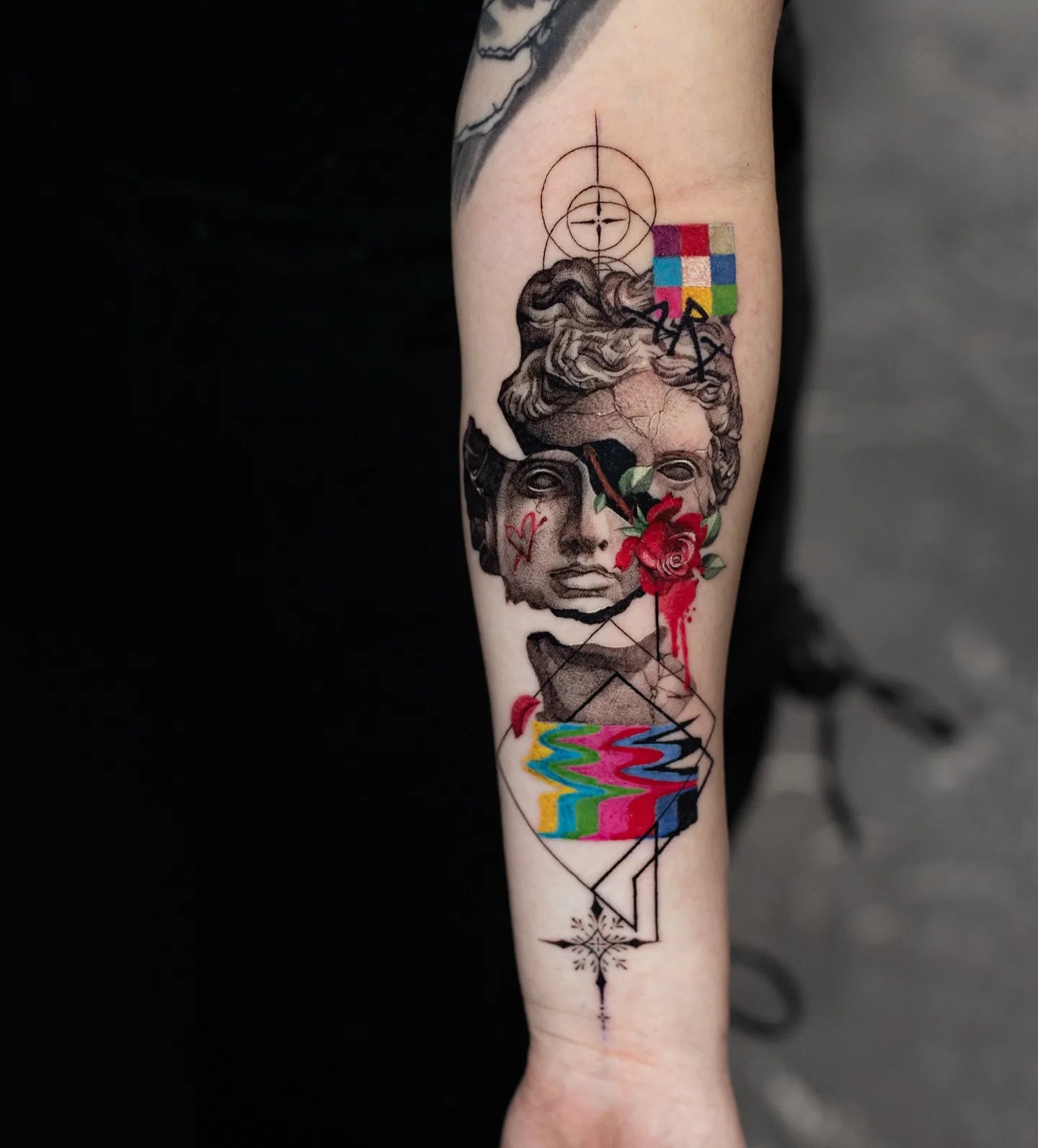 abstract greek broken statue color realism tattoo on forearm