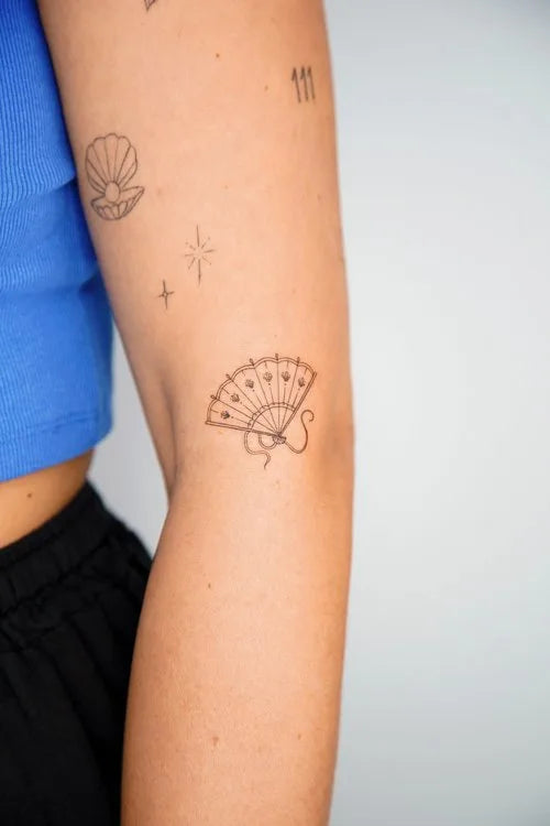 simple Japanese fan outline minimalist tattoo