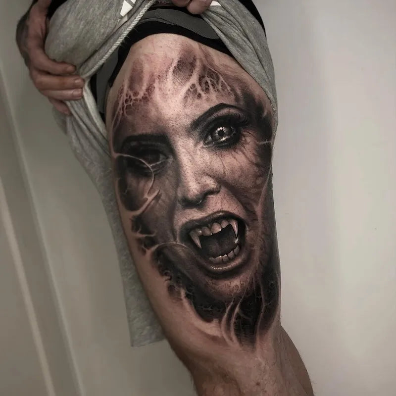 woman face portrait black and grey darkwork realism tattoo on full thigh