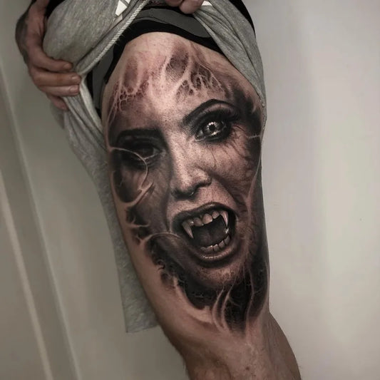 woman face portrait black and grey darkwork realism tattoo on full thigh