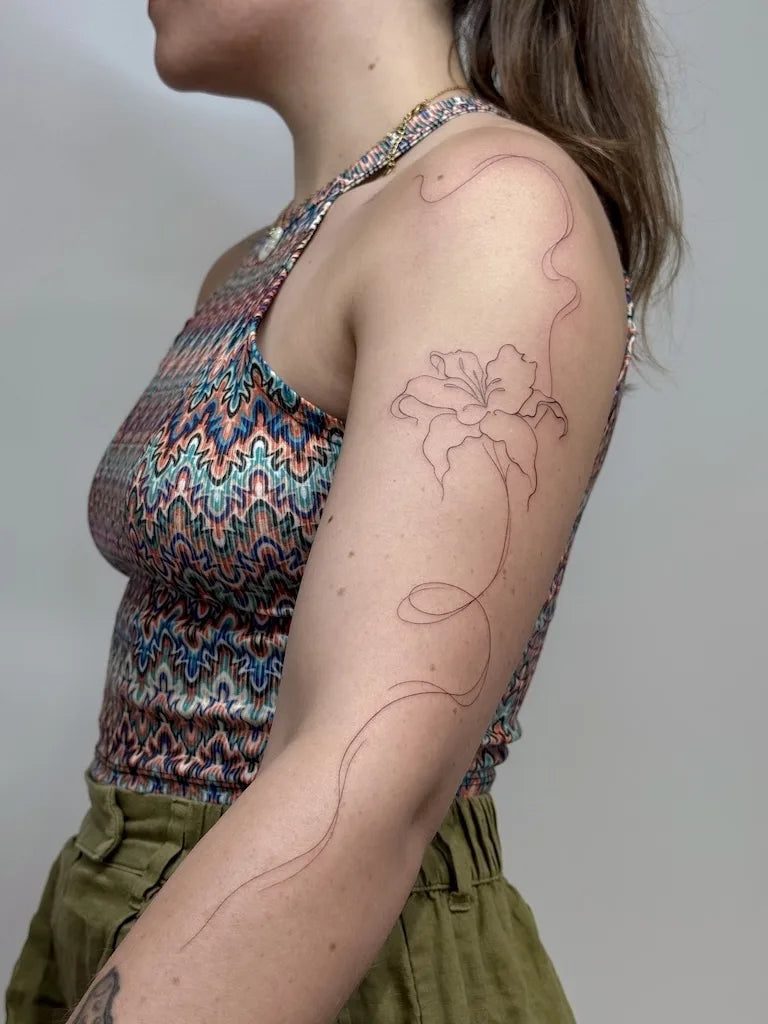 flower outline fine line woman full arm tattoo