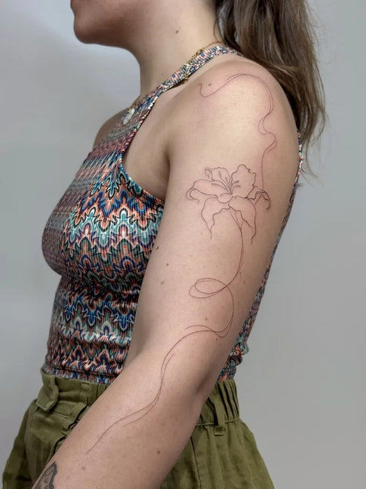flower outline fine line woman full arm tattoo