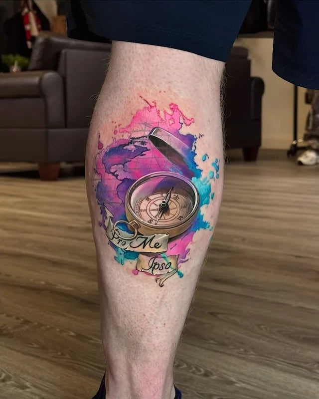 colorful compass tattoo on man calf