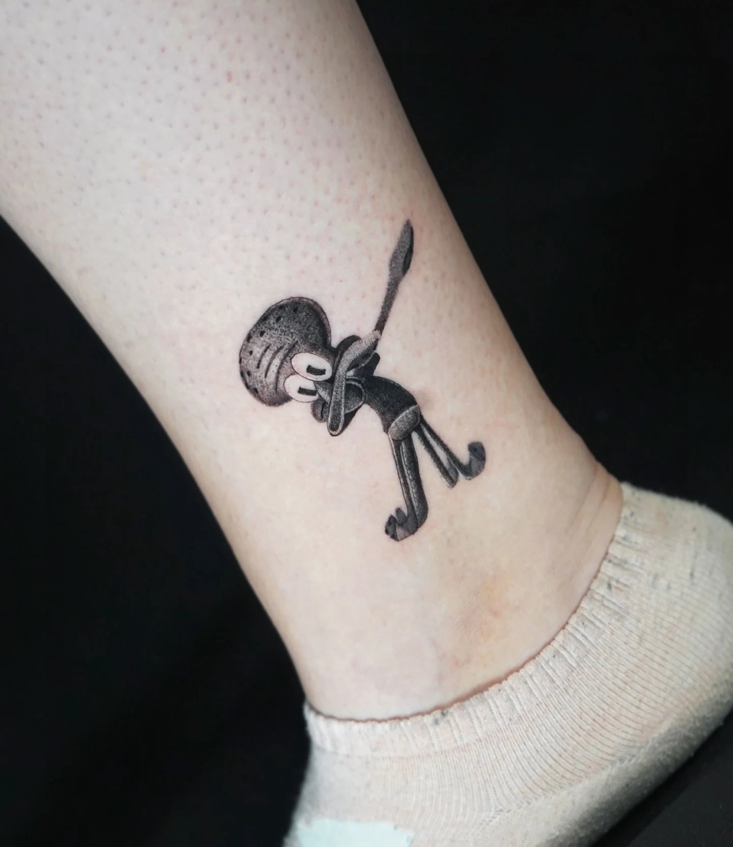 realistic dotwork dabbing spongebob squidward tattoo on ankle
