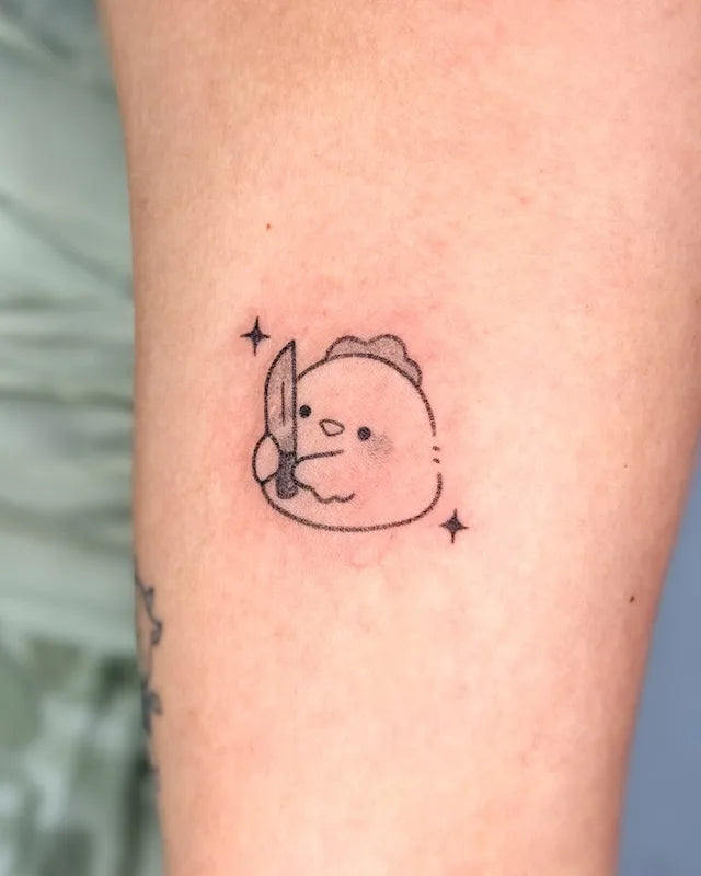 cute cartoon chicken with knife hand poke minimalist tattoo
