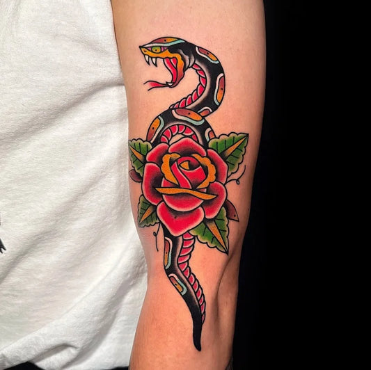 american traditional snake with rose flower tattoo on arm