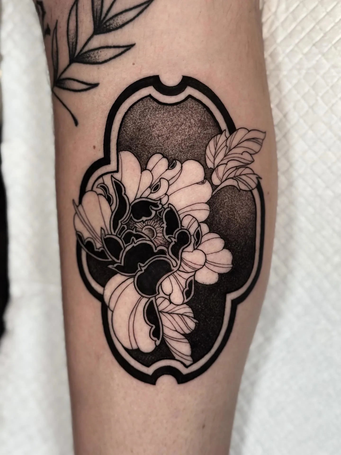 blackwork dotwork floral tattoo on arm