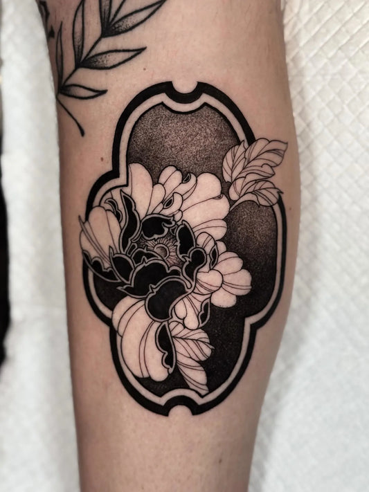 blackwork dotwork floral tattoo on arm