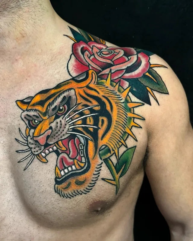 traditional tiger and rose tattoo on man shoulder and chest
