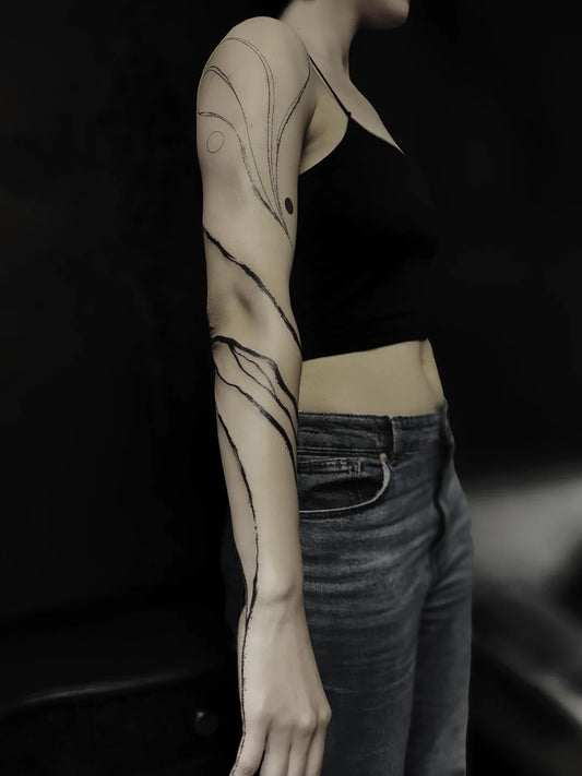 blackwork abstract lines on woman arm