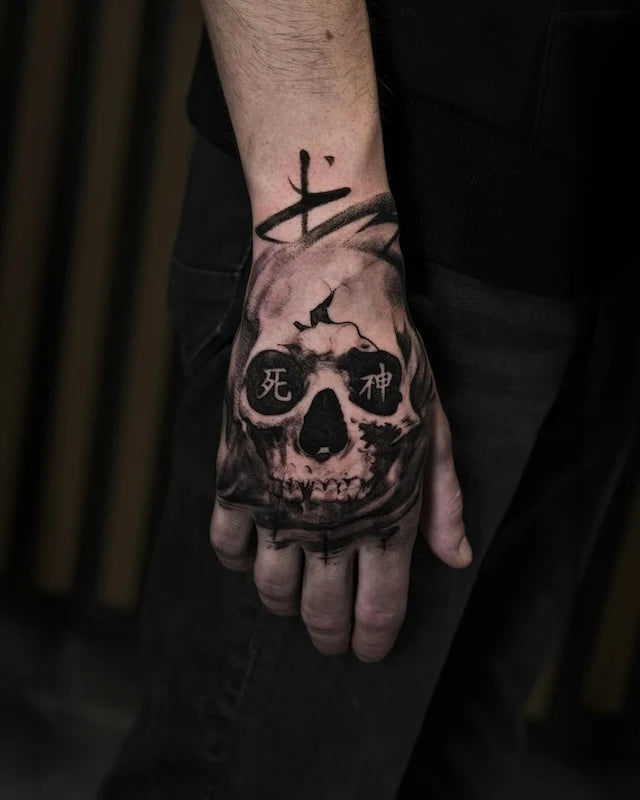 black and grey skull hand tattoo with chinese characters 死神