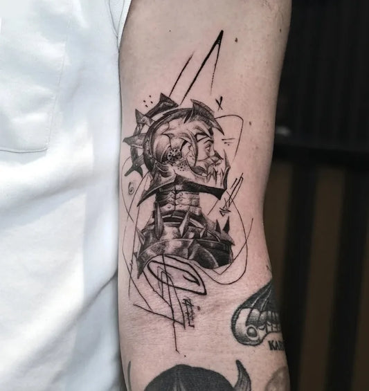 black and grey abstract warrior tattoo on inner arm
