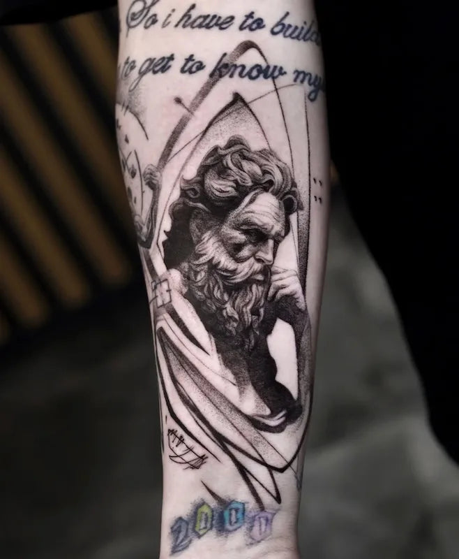 black and grey greek god zeus portrait realism tattoo on forearm