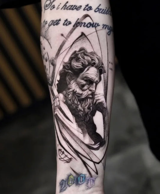 black and grey greek god zeus portrait realism tattoo on forearm