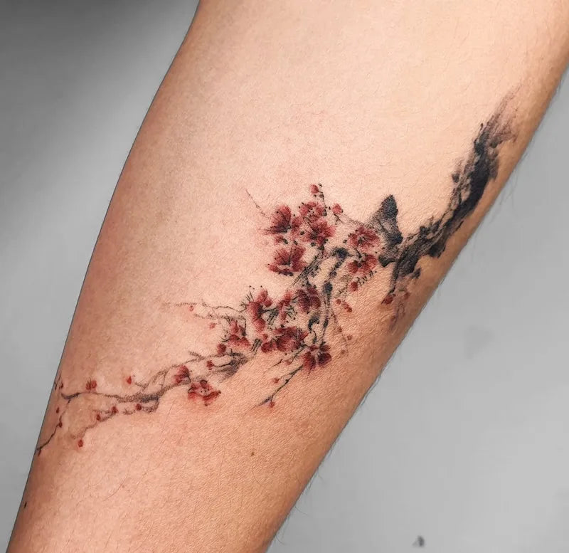 realistic color cherry blossom tattoo on arm