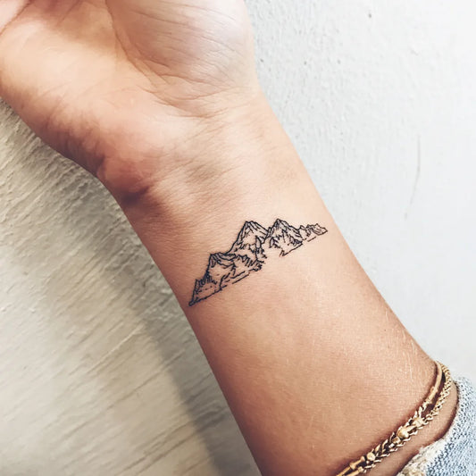 Small Mountain Range Wrist Tattoo for Women