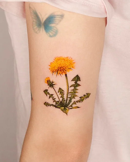 realistic yellow chrysanthemum flower on woman upper arm