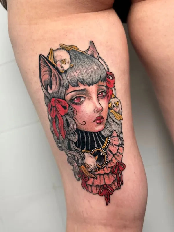 colorful girl with animal ear illustrative tattoo on thigh back