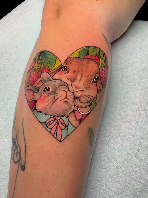 two rabbits in heart shape frame colorful tattoo
