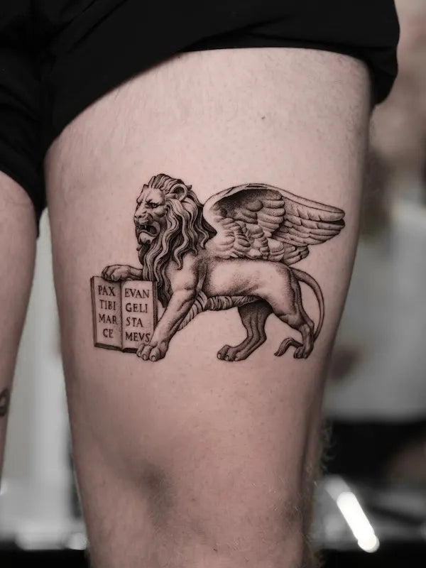 black and grey realism lion of saint mark tattoo on thigh
