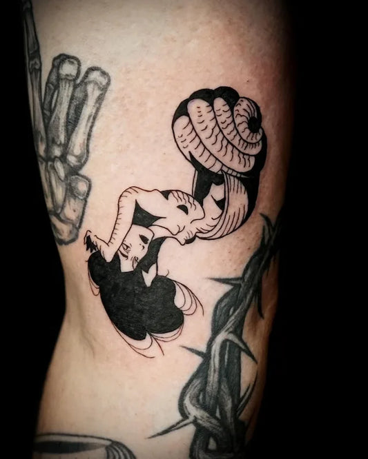 black white woman in shell illustrative abstract tattoo