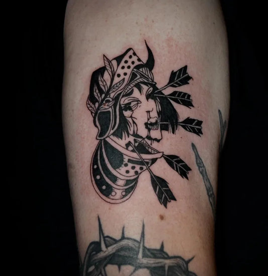 black and white traditional creepy woman face with arrows darkwork tattoo