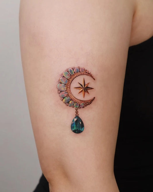crescent moon and star and green gemstone color realism tattoo