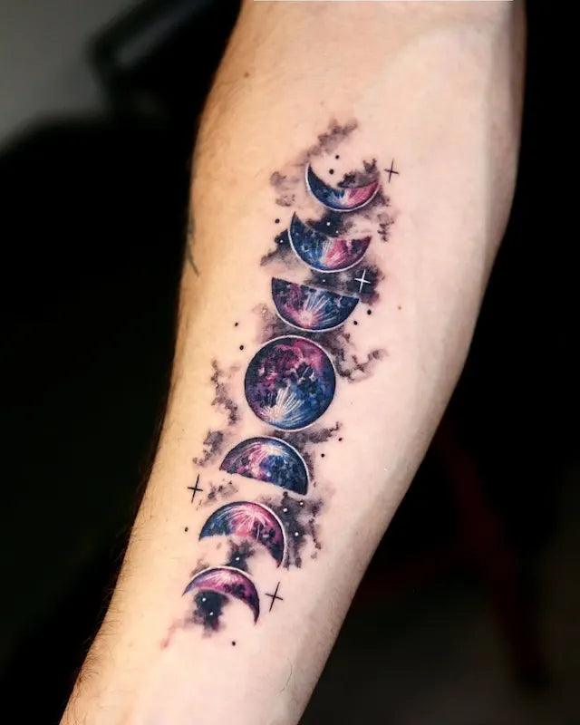 dark purple blue moon phase color realism attoo on man inner forearm