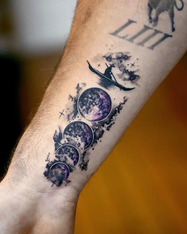 dark purple moon phase abstract tattoo on man forearm