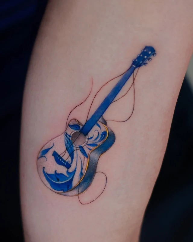 blue gold ceramic porcelain guitar tattoo