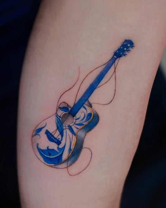 blue gold ceramic porcelain guitar tattoo