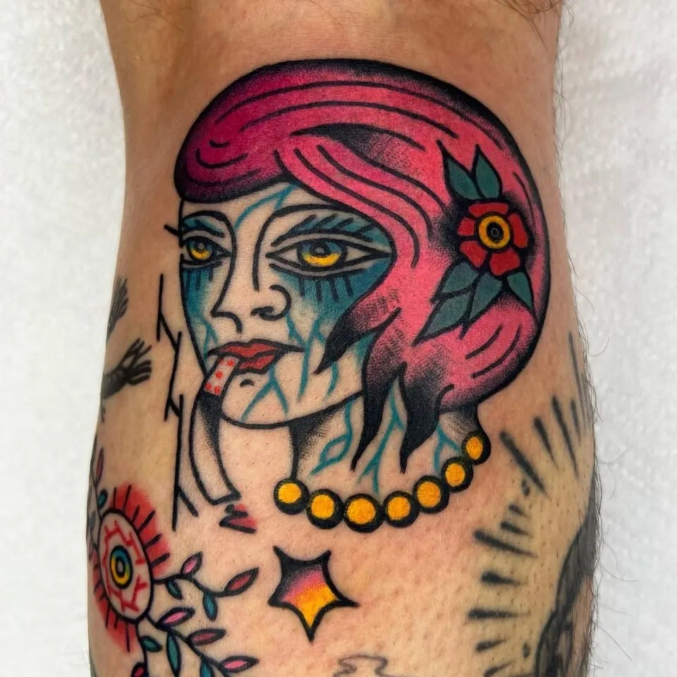 american traditional creepy woman face tattoo