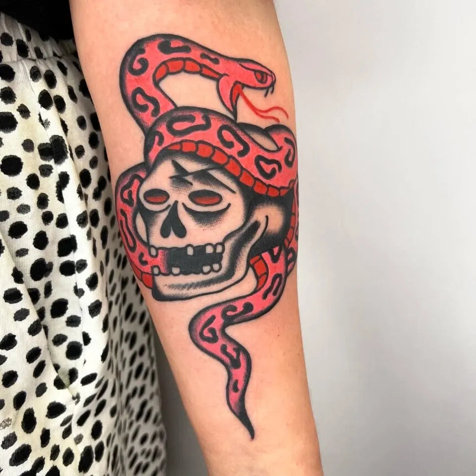 american traditional skull with red snake tattoo
