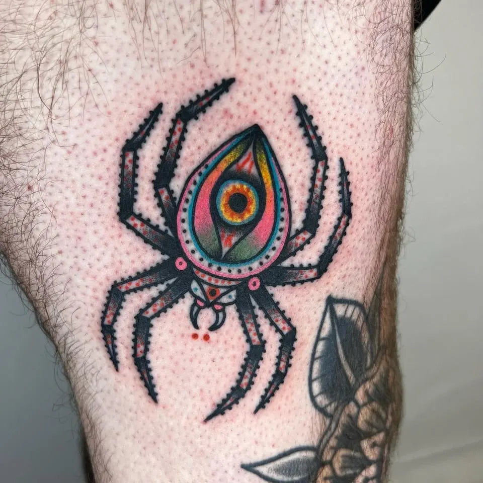 american traditional spider with an eye tattoo
