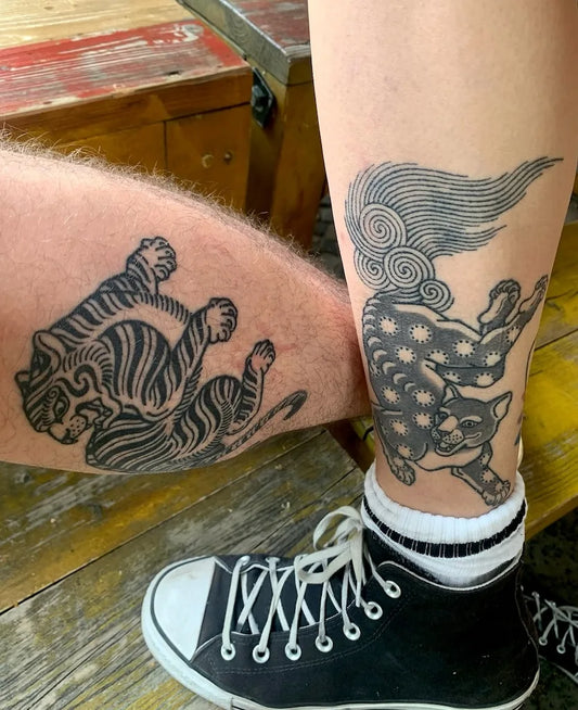 thai traditional animal tattoos on leg ankle