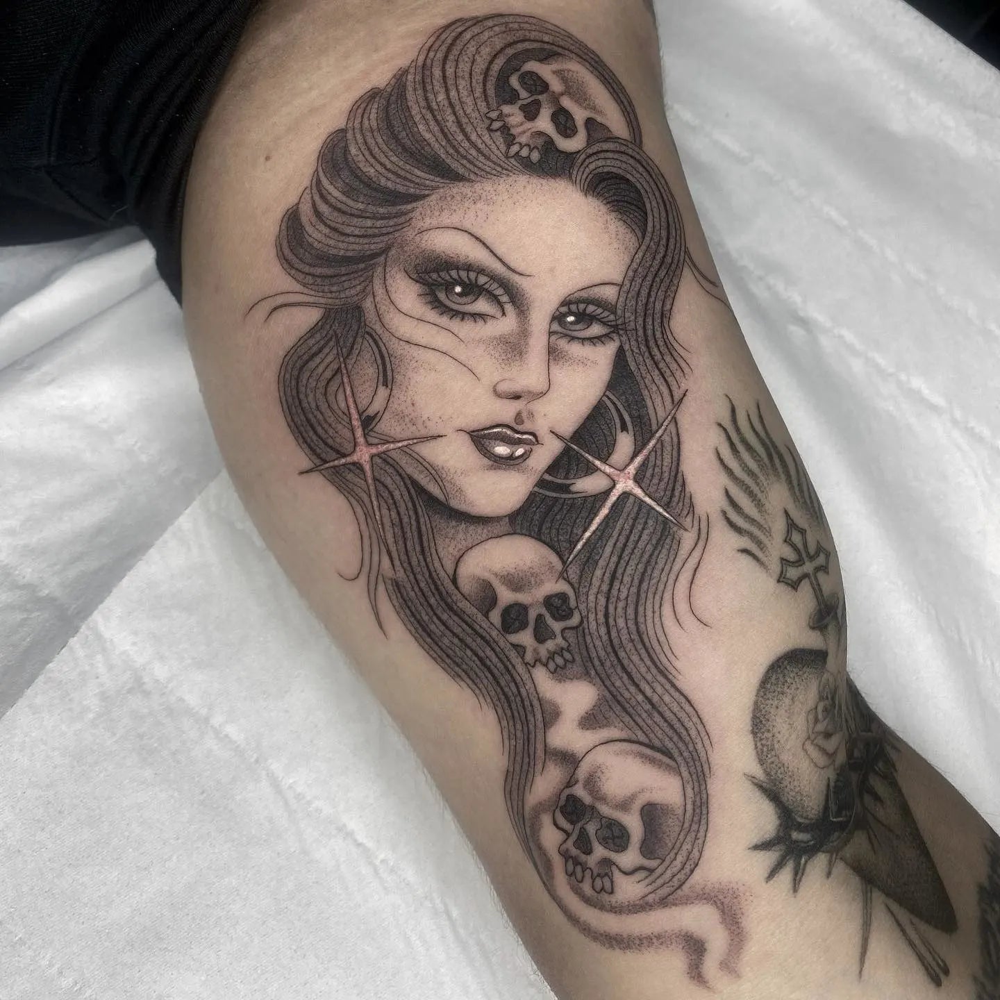 black and grey chicano woman and skulls tattoo