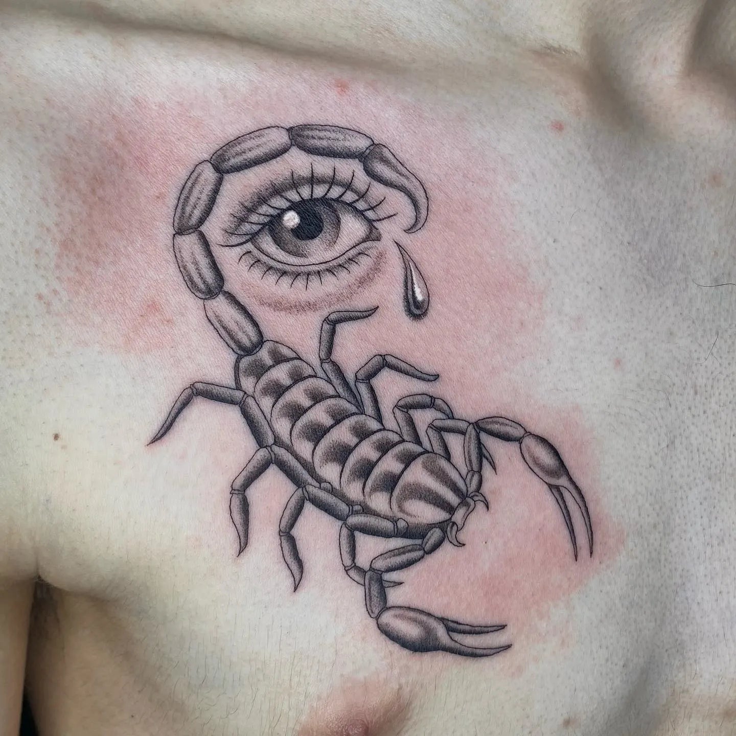 Scorpion tattoo with an eye teardrop design