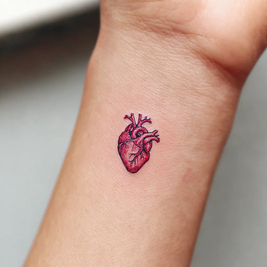 Tiny Red Anatomical Heart Wrist Tattoo for Women
