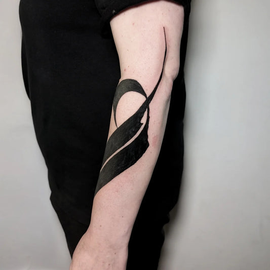 blackwork abstract tattoo on man arm