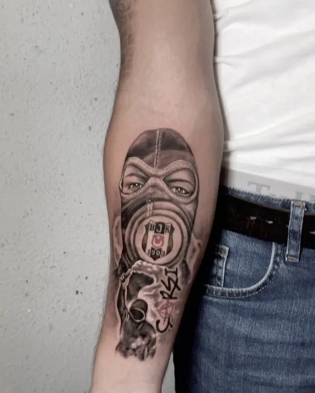 black and grey masked man thief tattoo on forearm